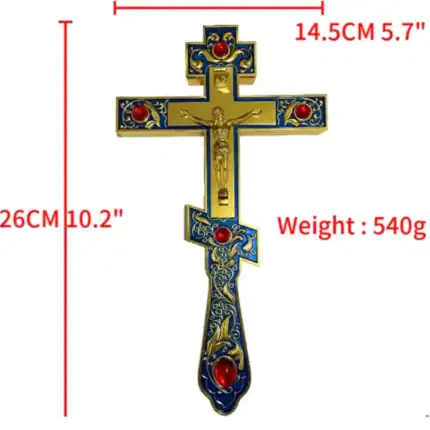 Croix catholique murale avec détails en or et pierres rouges.